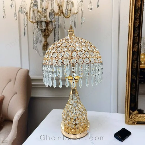 Luxury Gold Metal Table Lamp with crystal hanging shade, perfect for an elegant home decor setting.