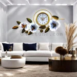 Luxury Floral Metal Wall Clock with butterfly and white flowers, showing premium quality size above a living room sofa.