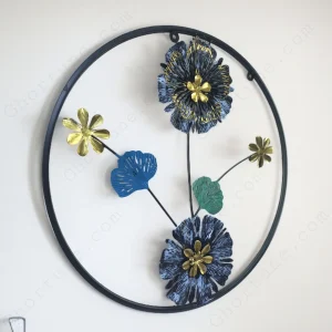 Modern Blue and Black Metal Wall Art in a circular frame hanging on a white wall for living room decor.