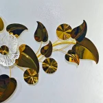 Detailed view of the Luxury metallic gold and black leaves on the Premium Quality floral wall hanging.