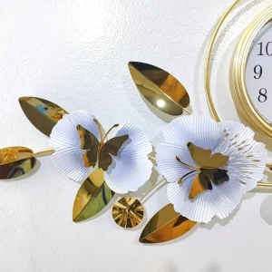 Detailed view of the Luxury white flowers and gold butterfly accents on the Top Quality metal wall clock.