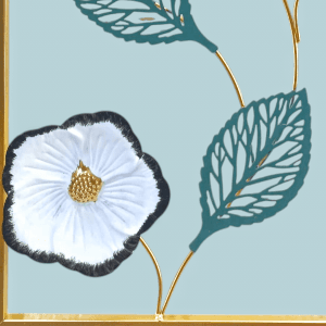 Decorative Metal Wall Decor art piece with gold accents and rectangular frame mounted on a white wall.