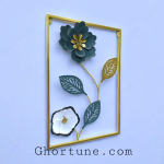 Detail shot of the Gold Frame Art showing the thin metal stem and layered metallic leaves of the Modern Floral Wall Hanging.