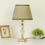 Detail of beige pleated lamp shade texture with dark brown border