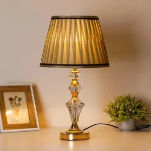 Luxury table lamp with pleated beige shade and glowing warm light - GhorTune BD